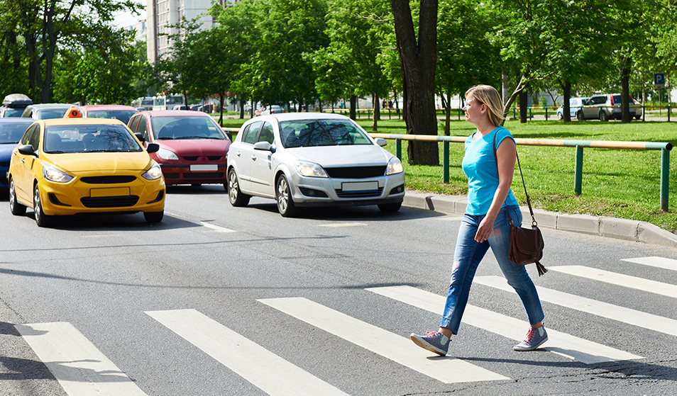 women crossing street